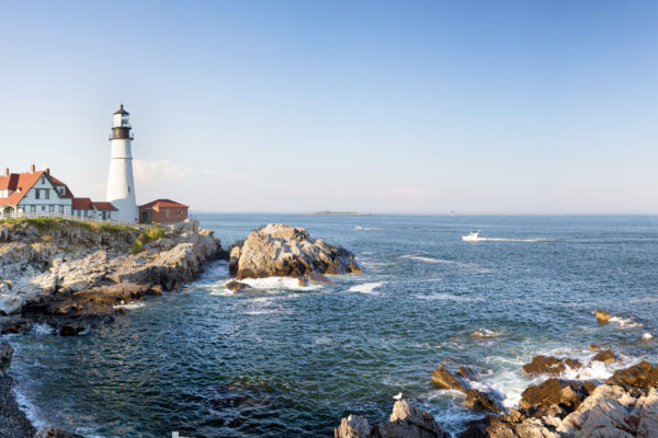 Coastal scene with a lighthouse and rocks