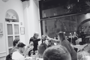 Man and woman toasting at a company dinner
